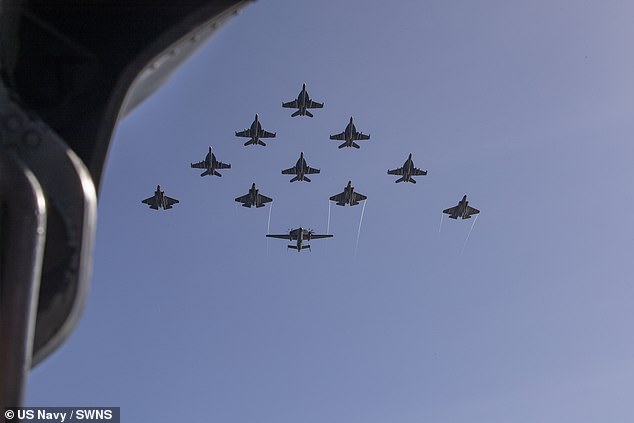 While the Government has not confirmed the precise route of 'Operation Highmast' - the codename for the deployment - the Navy has not ruled out sailing through the contentious 110-mile wide Taiwan Strait. Pictured: U.S. Navy aircraft during the dual carrier operations on Friday, July 18