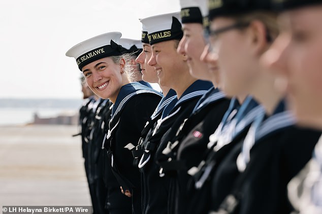 Banners and flags were waved by members of the public from the walls and beach of Portsmouth harbour with sailors aboard the 65,000-tonne warship waving back to cheers from the crowds as they passed. Pictured: Royal Navy sailors ahead of HMS Prince of Wales setting sail