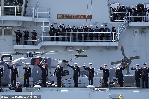 The ship's company on the aircraft carrier appeared in high spirits as they waved to the crowds gathered in Portsmouth in April