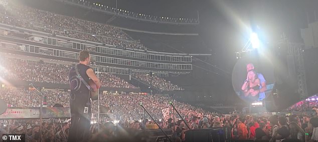 'You might believe you’re invincible, but not in this age of deliciously indiscriminate technology. You might travel miles to a concert in the belief you won’t be spotted, but these days, walls have eyes as well as ears.' Pictured: The concert with the pair on the kiss cam