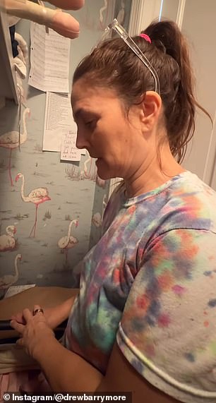 Drew wore a colorful tie-dye T-shirt with pale pink Free City sweatpants as she had her hair up in a ponytail