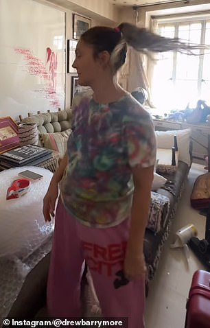 The video began with her breaking down in tears as she stood in front of a home office