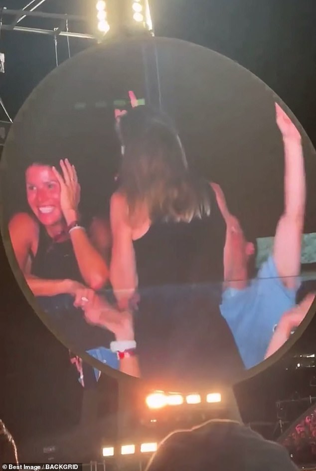 The viral clip from the Coldplay concert featured frontman Chris Martin panning his 'kiss cam' around the audience before landing on the pair, who looked horrified , as the singer quipped: 'Oh, look at these two - either they're having an affair or they're just very shy'