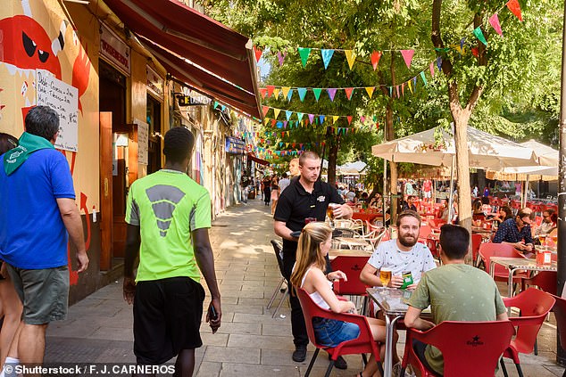 A common language mistake is assuming 'embarazada' means 'embarrassed' because of the similarity in spelling. In fact, 'embarazada' means 'pregnant' (pictured: tourists in Madrid)