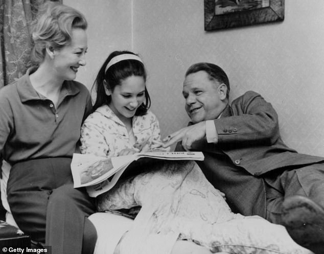 Larry, his third wife Claude and daughter Sappho reading a newspaper together in March 1962. Sappho later accused her father of incest