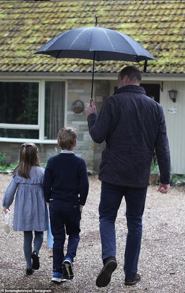 William, George and Charlotte brave the rain at Sandringham