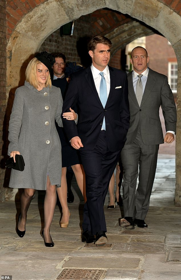 Oliver Baker (centre) with partner Mel and Michael Tindall (right) arrive at Chapel Royal in St James's Palace, central London for the christening of Prince George on October 23, 2013