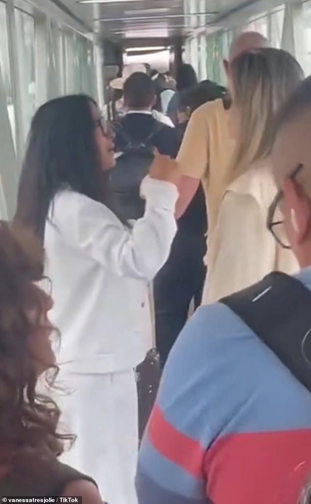 As on-lookers gazed on in shock, Angelina, 50, and Salma, 58, were filmed deep in conversation while waiting in-line for their flight