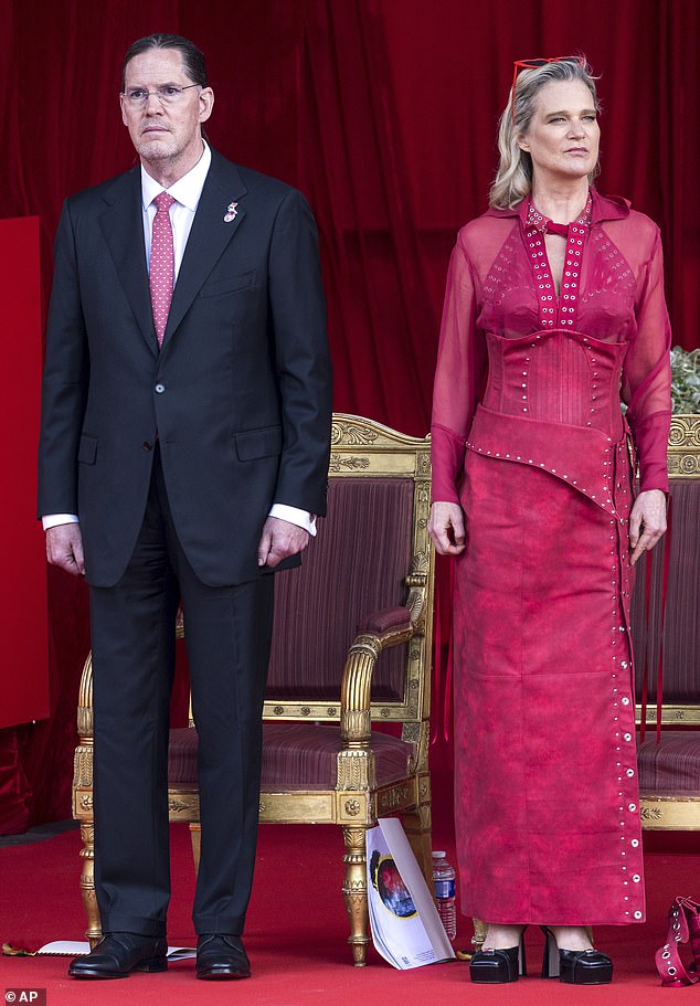 Pictured: Belgium's Princess Delphine and her husband James O'Hare watching the official military parade as part of National Day events