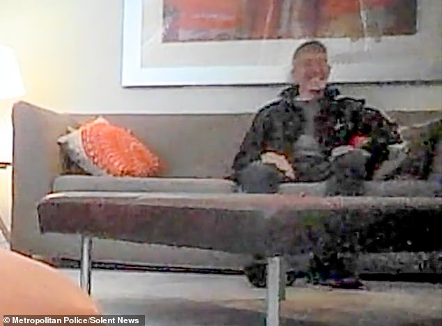 Phillips grins as he speaks to people he believed were Russian agents