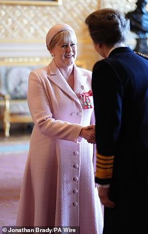 Lancashire shook hands with the royal after being awarded the honour
