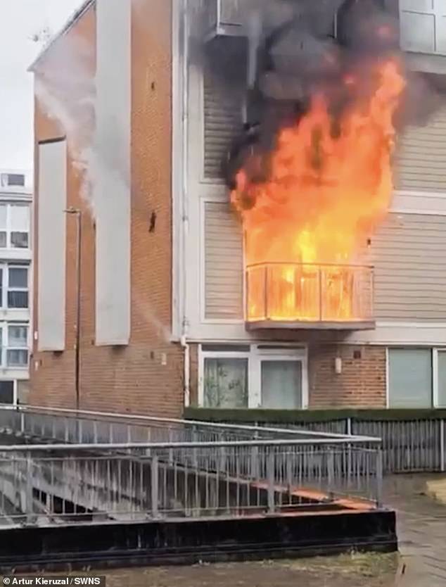 The blaze completely ripped through the home with the fire leaping out of the flat and engulfing the balcony as well as licking at the flats above