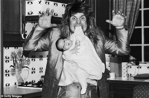Osbourne is pictured with his then newborn son Jack in 1985, six years after he had been thrown out of Black Sabbath due to his antics
