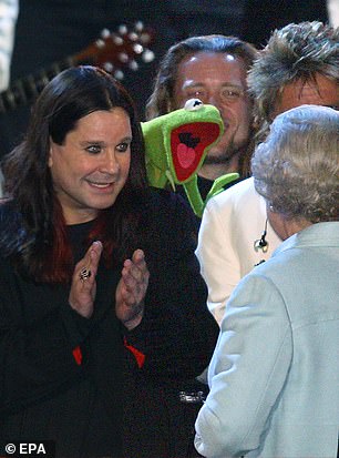 Osbourne was shocked by the invitation to appear. 'I hardly think of myself as royal material,' he said. 'My wife told me, and I thought "You're pulling my leg."' Above: The star meeting The Queen during the event