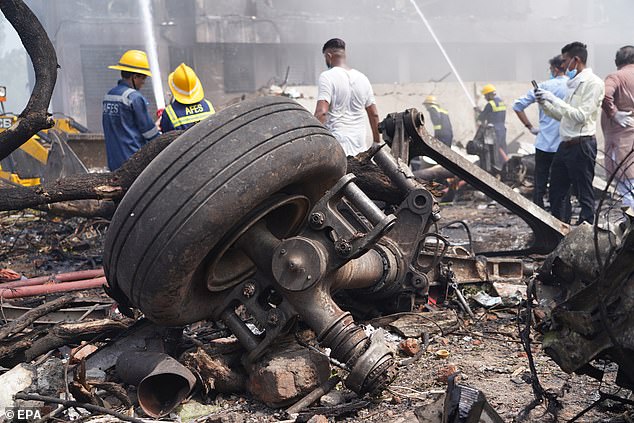 Pictured: Debris at the site of a plane crash near Sardar Vallabhbhai Patel International Airport in Ahmedabad