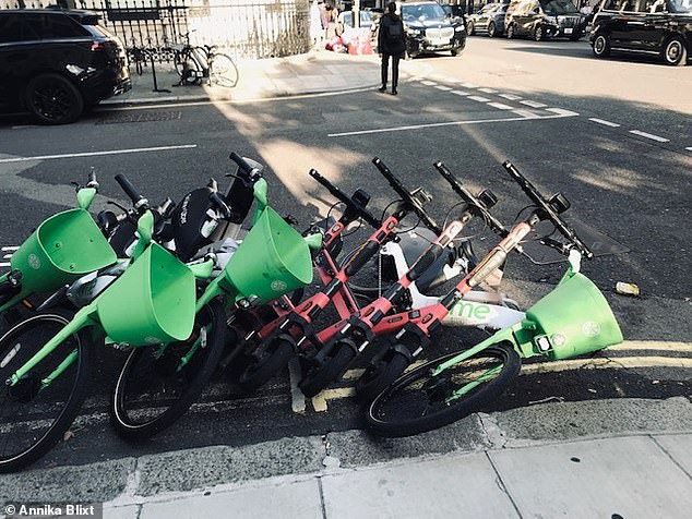 A pile of e-bikes which have fallen on their side at the dockless parking bay in London