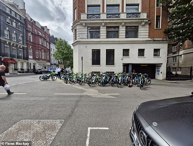 One local said it is 'only a matter of time' before someone is seriously injured as drivers can't see past the mountain of bikes