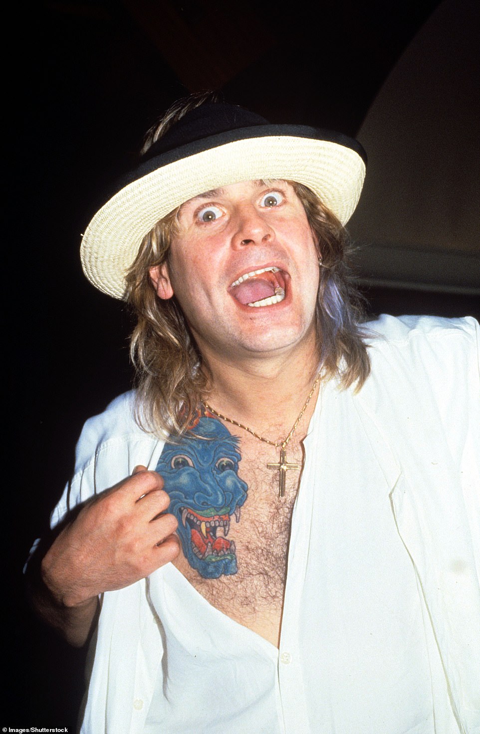 Osbourne is pictured showing off a tattoo in 1990. The singer had by then been out of Black Sabbath for more than a decade