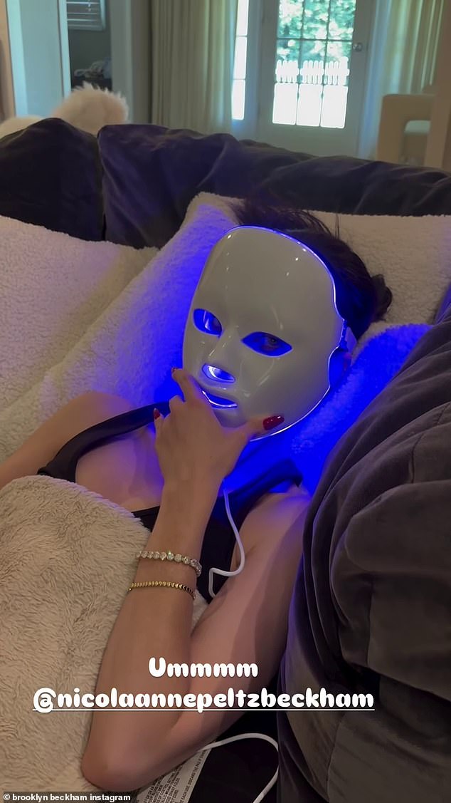 After returning home, Brooklyn poked fun at wife Nicola Peltz's morning ritual as he filmed her wearing a LED face mask as she relaxed in their Los Angeles home