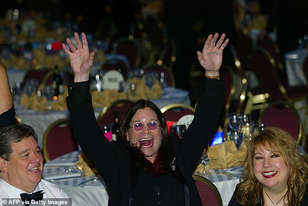 Black Sabbath lead singer and MTV star British Ozzy Osbourne (C) parties at the 2002 annual White House Correspondents Dinner, 04 May 2002, in Washington, DC