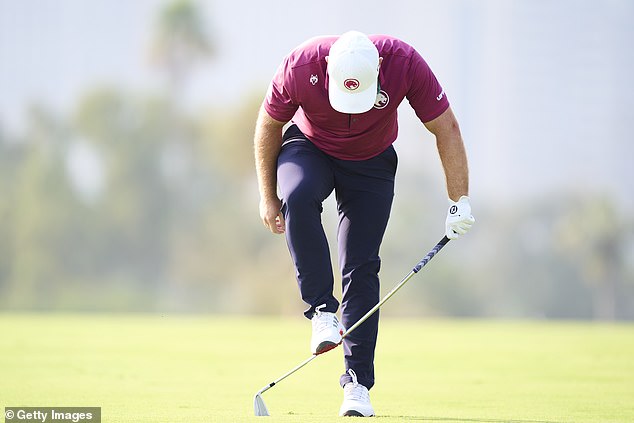 Tyrrell Hatton reacts with fury after a poor shot at the Dubai Desert Classic in January
