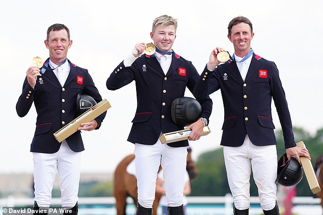 Great Britain's Scott Brash (left), Ben Maher (right) and Harry Charles celebrate with their gold medals