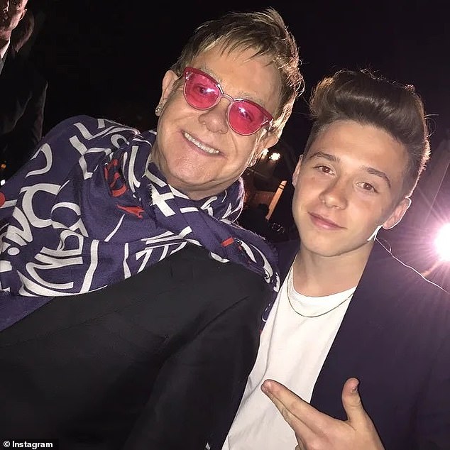 It comes hours after sources revealed that Elton invited Brooklyn (pictured with the singer) and Nicola for lunch at a swanky Cannes eatery in a desperate attempt to calm the family's feud