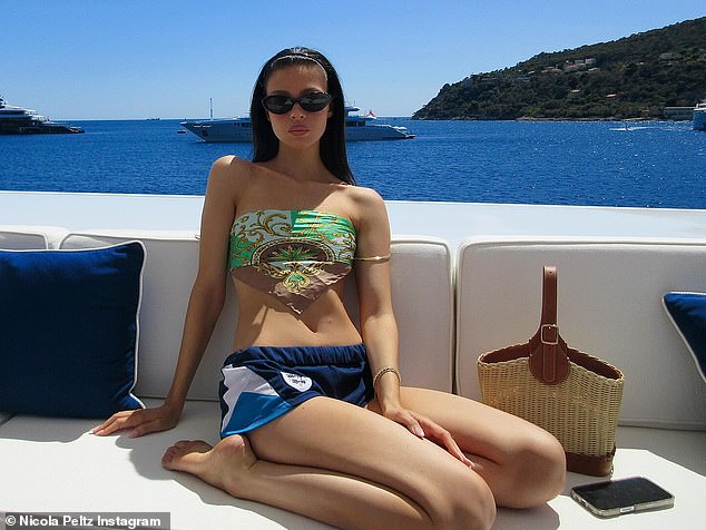 Nicola showed off her abs in a revealing paisley crop top as she relaxed on a luxurious yacht in her new Instagram post