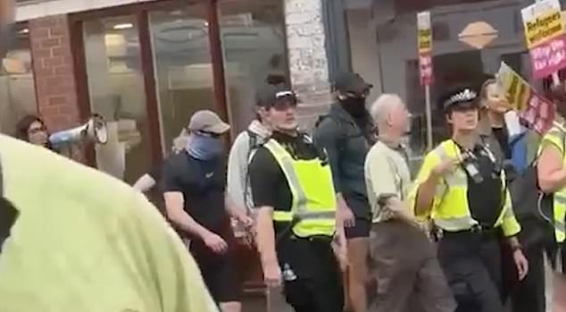 The group Stand up to Racism clashed with anti-migrant protesters as they carried signs saying 'refugees welcome' and quickly became a target for anger