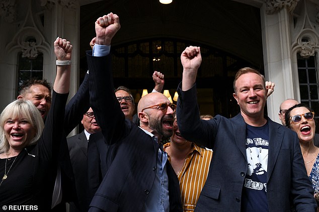 Former Barclays trader Carlo Palombo (left) and Former UBS and Citigroup trader Tom Hayes (right) celebrate after their conviction was overturned at the Supreme Court in London today
