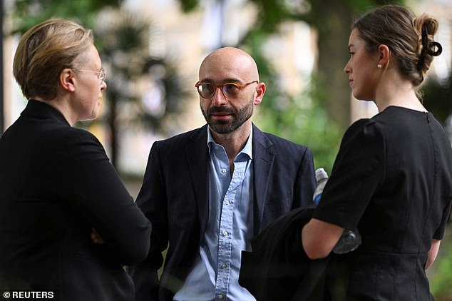 Former trader Carlo Palombo (centre) outside the Supreme Court today ahead of the ruling