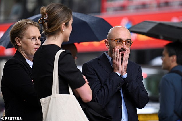 Former trader Carlo Palombo (right) outside the Supreme Court today ahead of the ruling