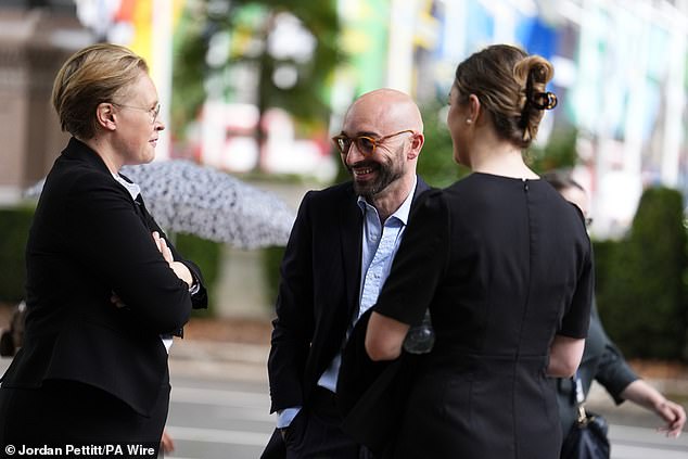 Carlo Palombo speaks with his legal team outside the Supreme Court in London today