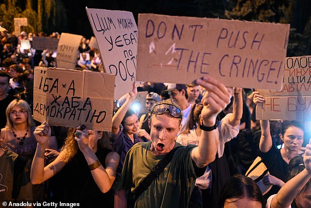 Protesters gathered outside government buildings to voice their outrage, and erupted in boos and jeers when news broke that it had been signed