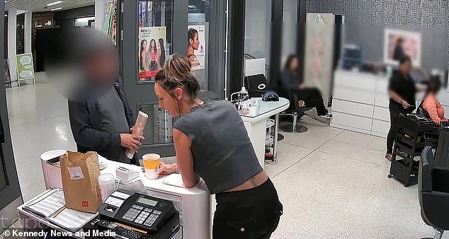 After the 42-year-old explained she didn't cut men's hair he claimed to be asking for his wife, so she walked behind her desk to fetch a price list