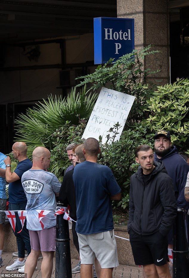 One placard brought by a group of protesters said: 'This is a peaceful protest to protect our own.'