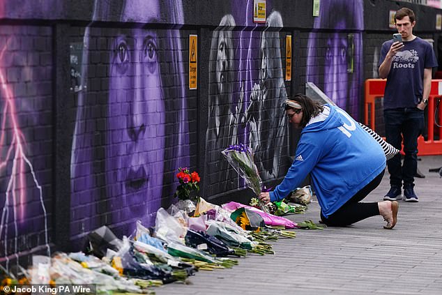 Fans lay tributes after the musician passed away on 22 July