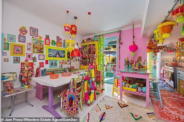 The colourful nature does not stop at the door, and the interior is even more full of quirky trinkets and furniture in every shade possible