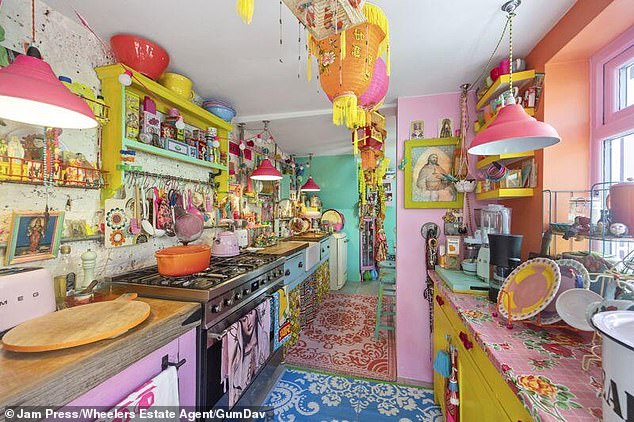Some may see there is a lot happening in the kitchen of this rainbow house