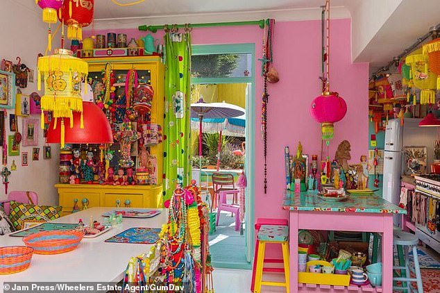 The property boasts four bedrooms, two bathrooms, two cosy lounges, a spacious and open-plan dining room, and a kitchen