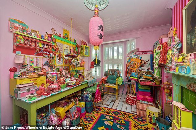 The property boasts four bedrooms, two bathrooms, two cosy lounges, a spacious and open-plan dining room, and a kitchen