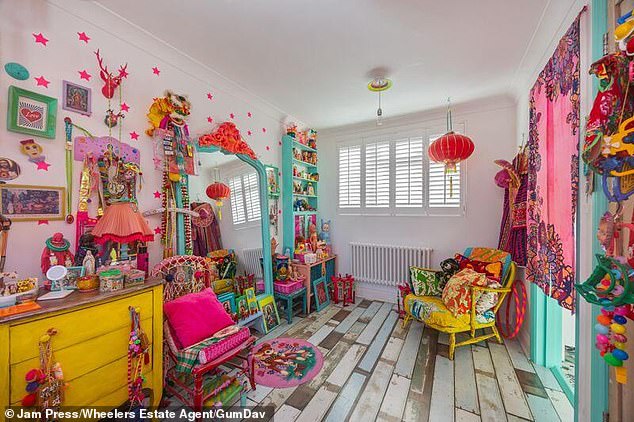 The listing, held by Wheelers Estate Agents for £625,000, describes it as a 'vibrant and spacious' home on a 'charming one-way street'
