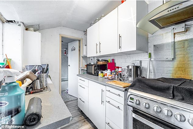 In the kitchen, potential buyers can see a bright orange scorch mark where an object appears to have caught fire