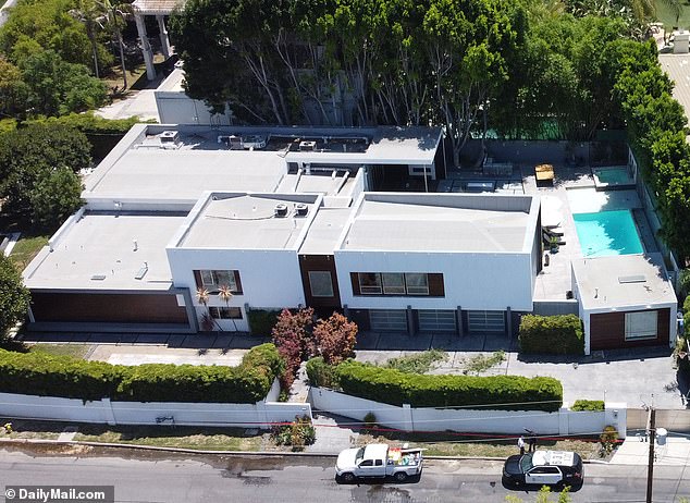 A 911 caller inside the couple's $5million Los Angeles mansion (pictured) was heard begging 'please don't shoot me' on July 10 during the home invasion that ended in a fatal shooting of Kaye and Deluca
