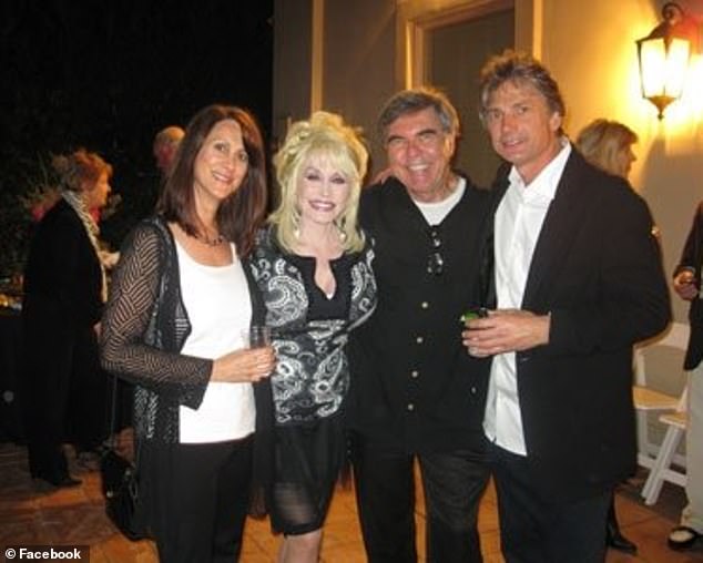 Robin Kaye (left) and Thomas Deluca (right) are pictured with Dolly Parton (2nd-left) in 2009