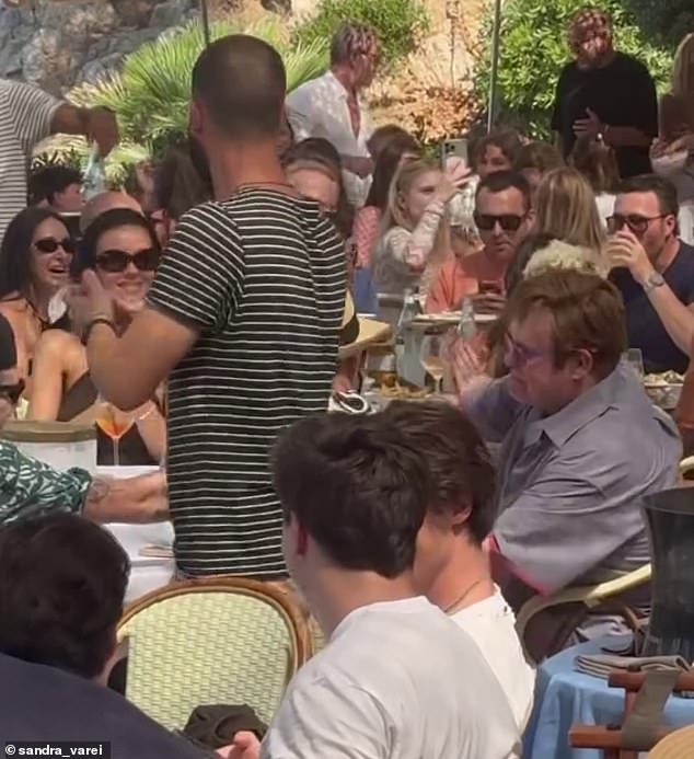 New pictures show the couple wining and dining with Sir Elton and his husband David Furnish where the hitmaker reportedly took the opportunity to 'say his piece'
