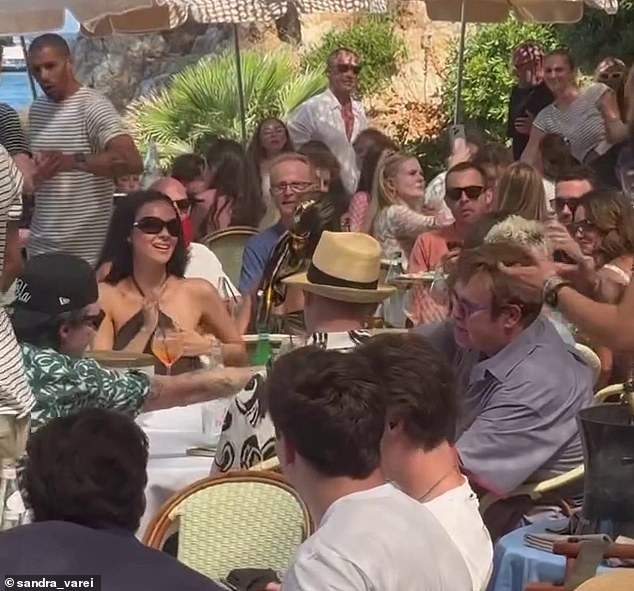 Nicola couldn't wipe the smile off her face during the lunch as she sipped on Aperol Spritz at the fancy beach club