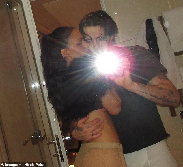 Packing on the PDA with her husband Brooklyn, Nicola cosied up to her spouse in the snaps