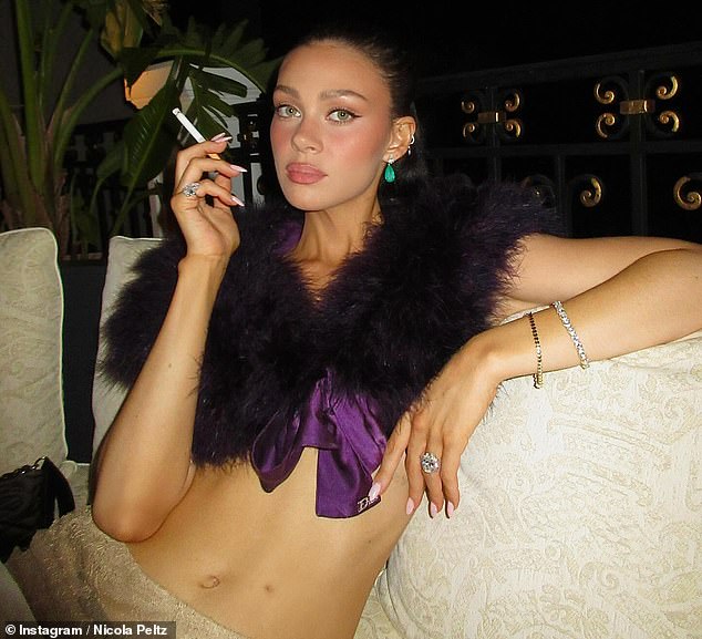 She went onto share another gallery of snaps from her idyllic summer, including eye-catching images with a cigarette in her hand