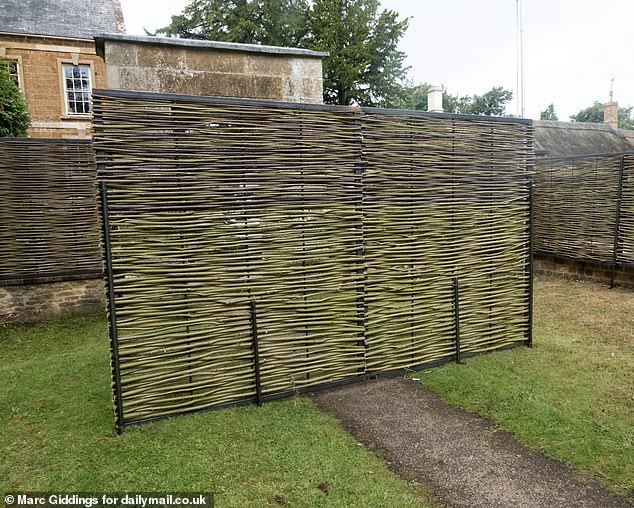 Screens have been erected around the perimeter of the church to give the wedding party privacy and prevent onlookers getting a look at the bride's dress before she says I do